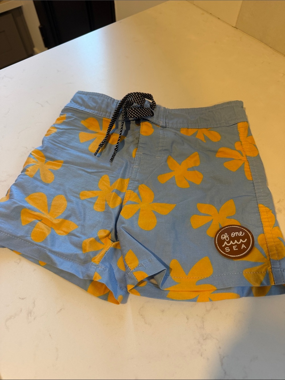 Kids Light Blue Swim Trunks with Yellow Floral Print